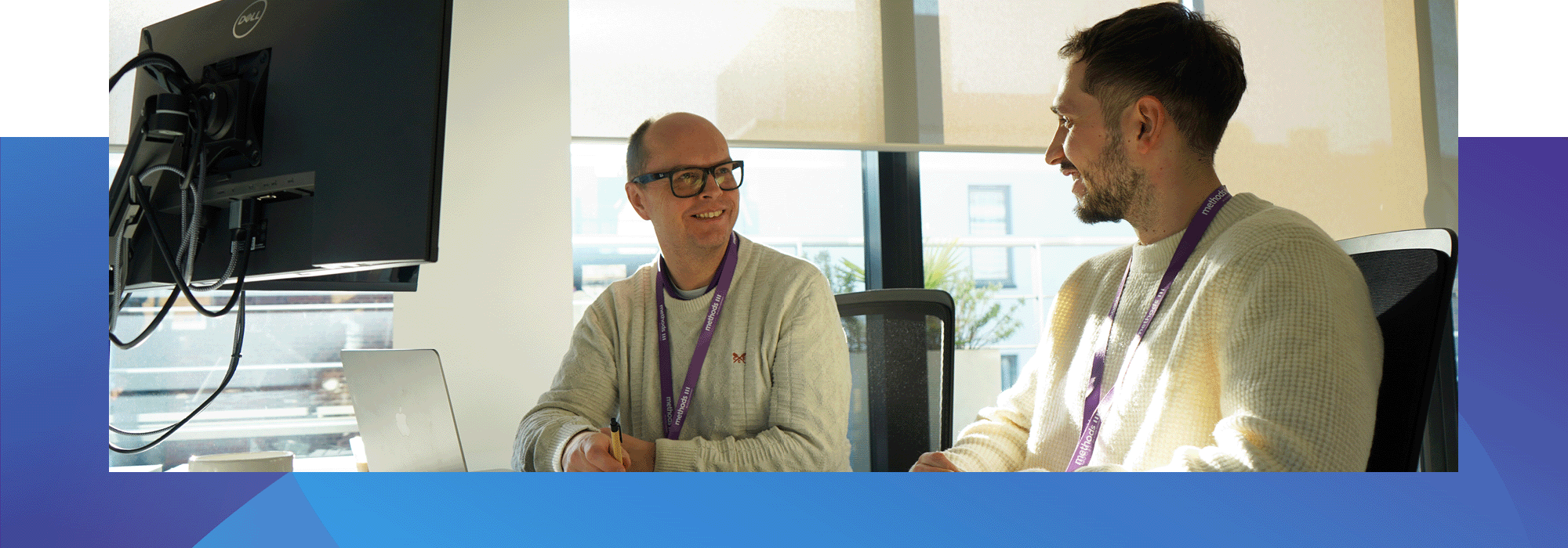 Two methods people at a desk in our london office